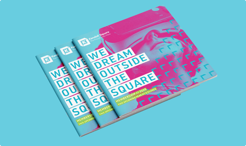 3 Kendall Square printed books with the cover "We dream outside the square"